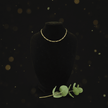 14ct Gold 18 45cm 4mm 31 Figaro Link Chain displayed on a black bust with greenery.