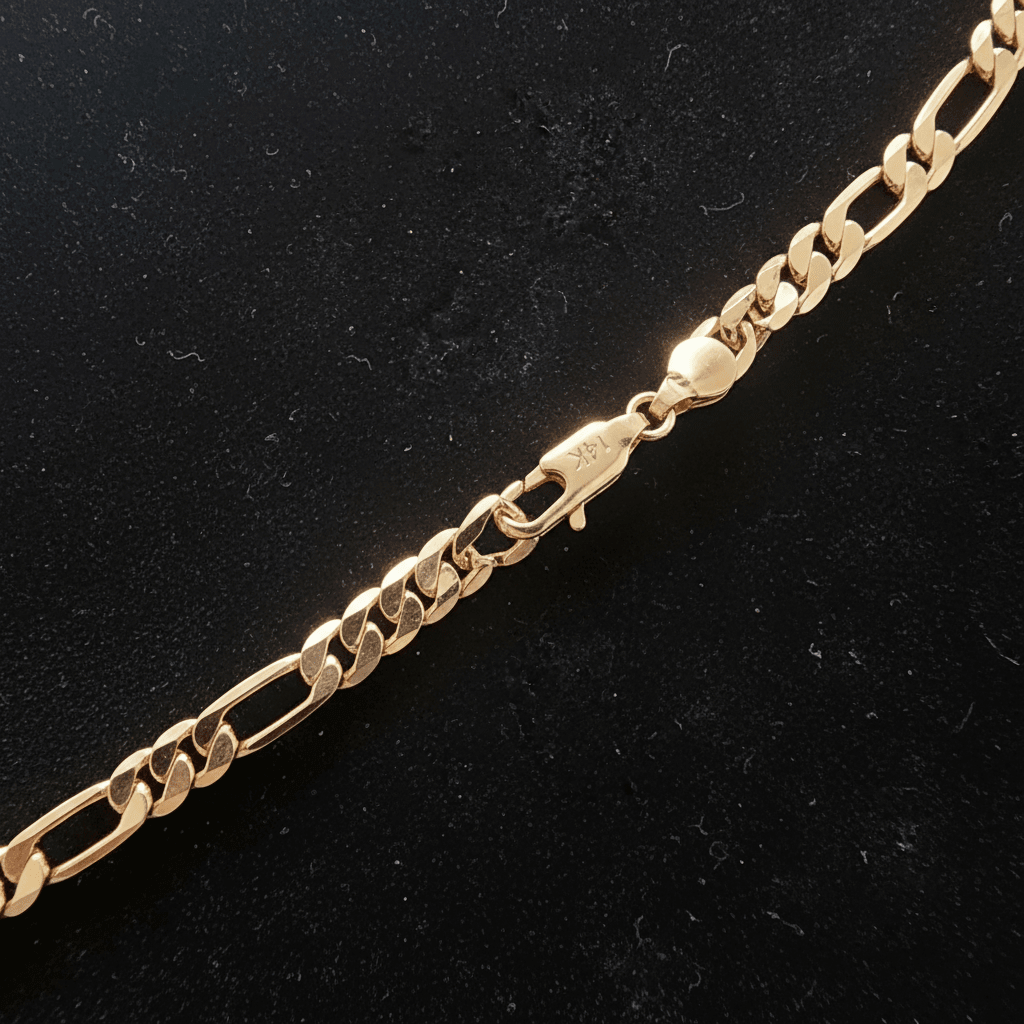 14ct Gold 24 61cm 5mm 31 Figaro Link Chain showing a close-up of the clasp and link design on a black background.