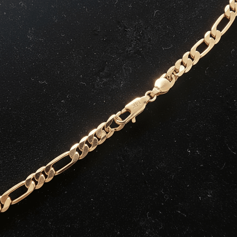 14ct Gold 24 61cm 5mm 31 Figaro Link Chain showing a close-up of the clasp and link design on a black background.