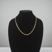 14ct Gold 24 61cm 5mm 31 Figaro Link Chain displayed on a black jewelry stand.