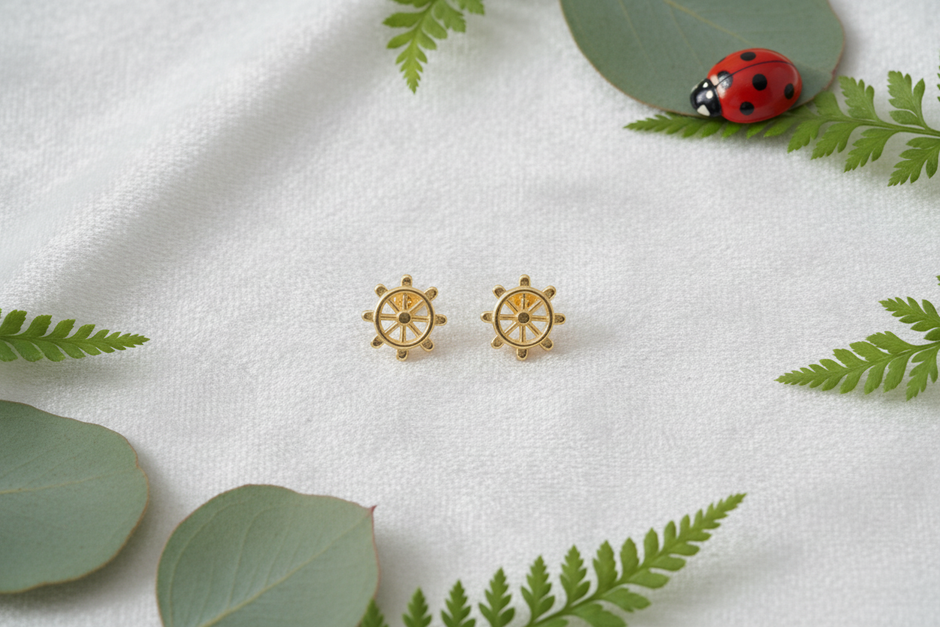 9ct gold ship wheel earrings with elegant greenery and ladybug