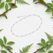 Anklet with greenery and ladybug