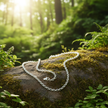 Belcher chain with lush green background and sparkle