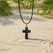 Black Moonstone cross close-up - with colorful flecks