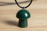 Bloodstone Mushroom Pendant – Wooden Surface
