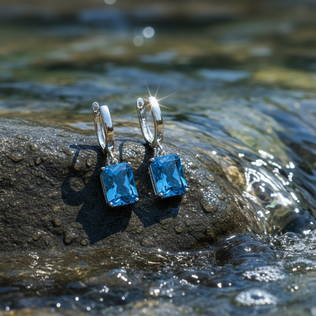 Blue Cubic Zirconia Drop Earrings on Rock by Water