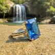 Blue Ring Sideways on Sand by Waterfall