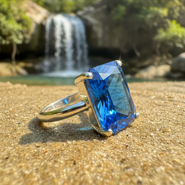 Blue Ring Sideways on Sand by Waterfall