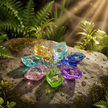 Colorful shell charms on rock with lush sunlit background - version 2