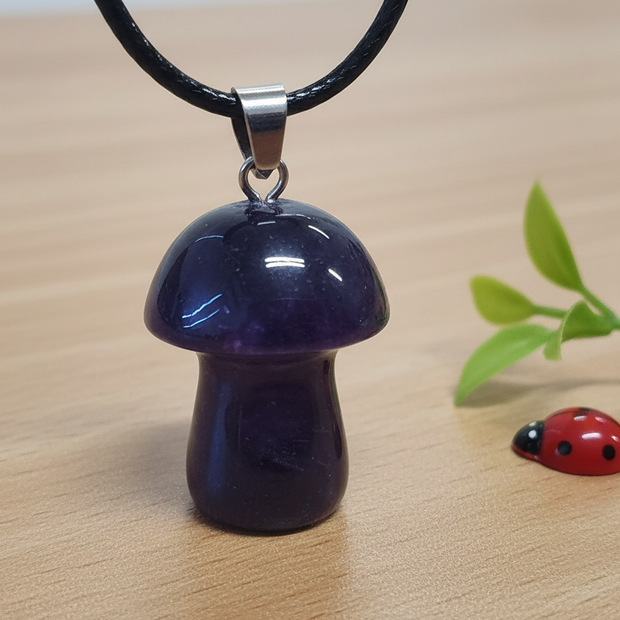 Dark Amethyst Mushroom Pendant – Wooden Surface