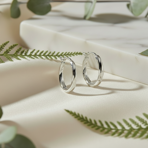 Elegant earring background with greenery and ladybug