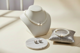 Enhanced pearl necklace with sparkling silver studs