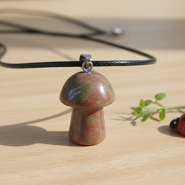 Fancy Jasper Mushroom Pendant – Wooden Surface with Greenery & Ladybug