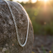 Figaro chain on rock with natural sunlight