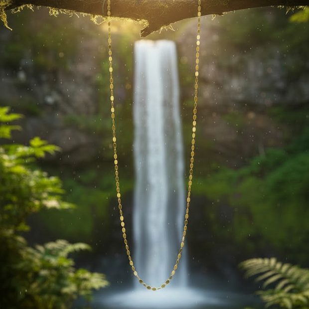 Gold chain with lizard on branch