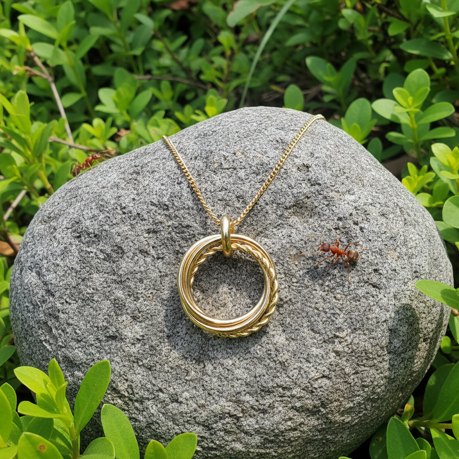 Gold necklace with natural realistic lighting and two bull ants