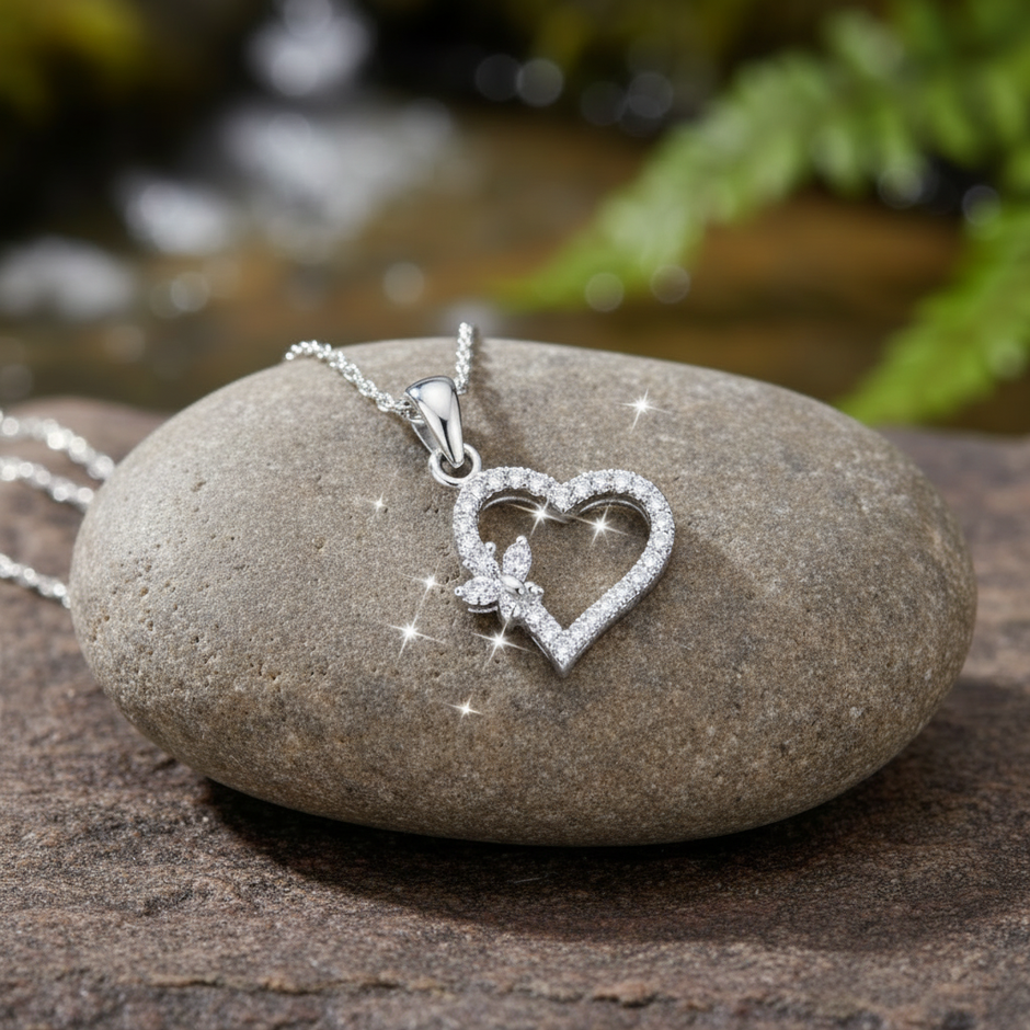 Heart pendant front view on rock - sparkling