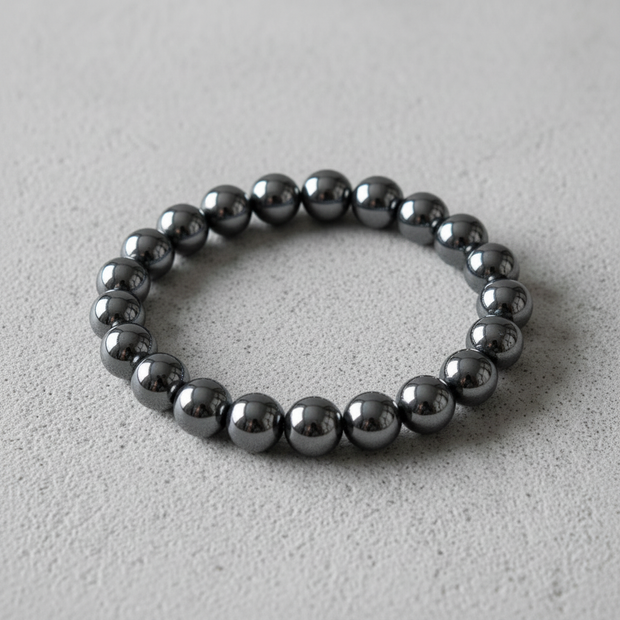 Hematite Bracelet Overhead on Concrete