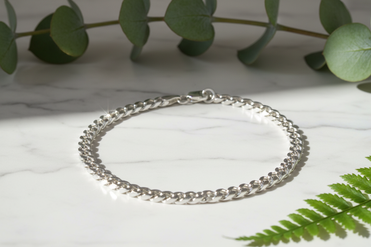 Italian 925 sterling silver curb chain bracelet on marble with greenery and sparkle