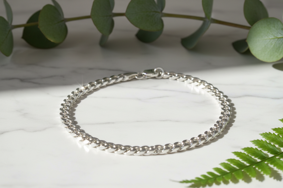 Italian 925 sterling silver curb chain bracelet on marble with greenery and sparkle