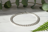 Italian 925 sterling silver curb chain bracelet on marble with greenery and sparkle