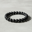 Lava Rock Bracelet Angled on Concrete