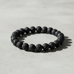 Lava Rock Bracelet Overhead on Concrete