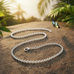 Long belcher chain with butterfly landing on rock
