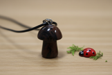 Mahogany Obsidian Mushroom Pendant – Wooden Surface