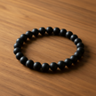 Matte Black Bracelet Angled on Walnut
