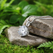 Moissanite Pendant Leaning on Rock