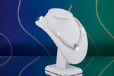 Pearl necklace on vibrant elegant background
