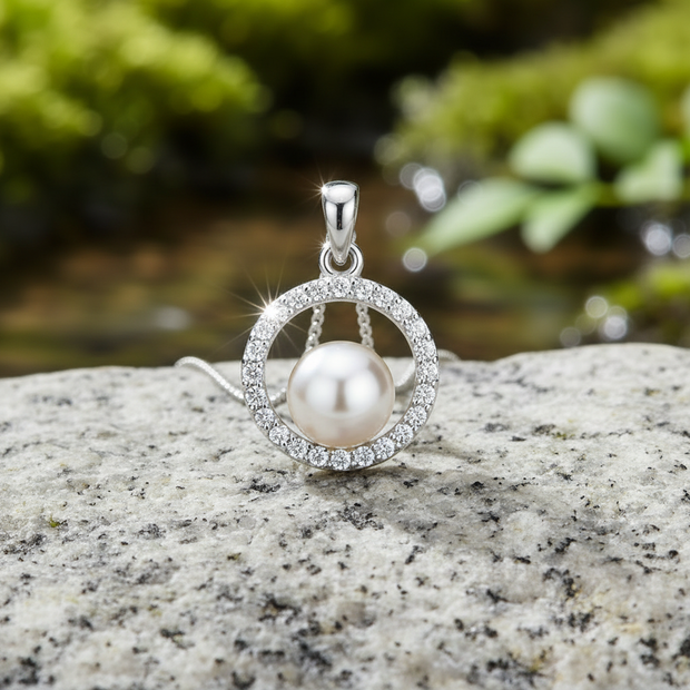 Pearl pendant front view on rock - sparkling