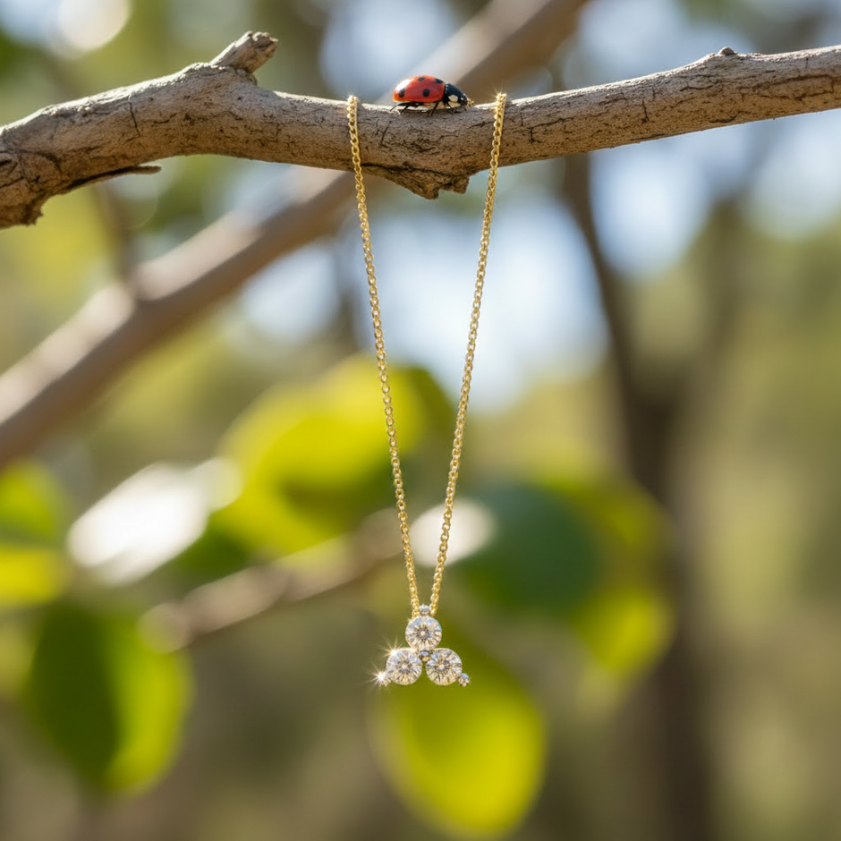 Pendant hanging from branch with ladybug
