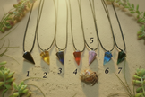 Pendant necklaces with sunlight and greenery