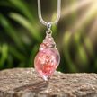 Pink shell charm close-up with visible interior details - v2