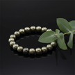 Pyrite angled with greenery