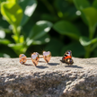 Rose gold heart earrings side view showing backs
