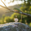 Rose gold heart pendant with lizard on branch