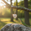 Rose gold heart pendant with lizard on rock looking up
