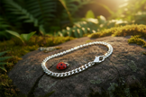 Silver bracelet with extra sparkle and ladybug on rock