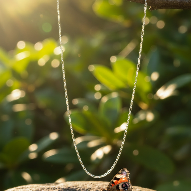 Silver chain with butterfly on rock