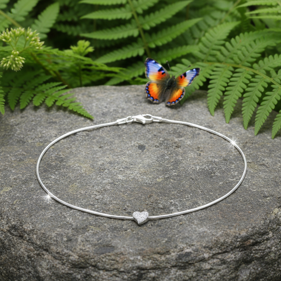 Silver heart anklet with butterfly on rock