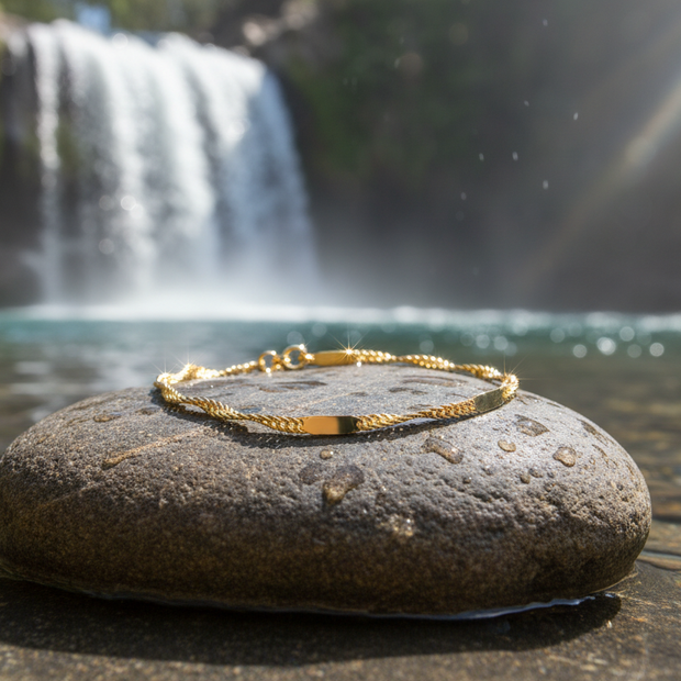 Singapore anklet on rock by waterfall