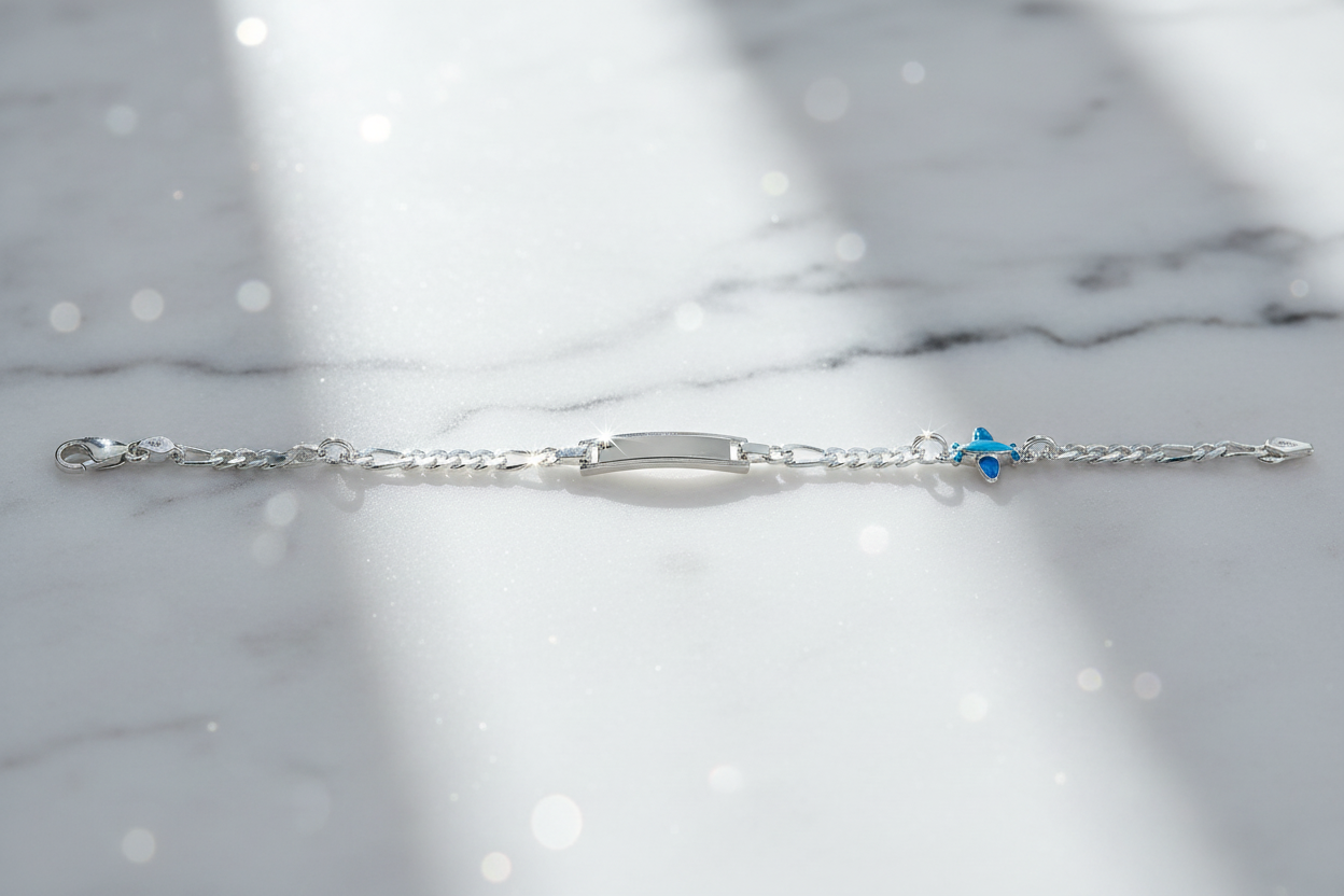 Sterling silver figaro chain bracelet with dramatic sparkle on marble background