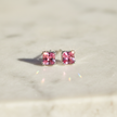 Sterling Silver Pink Cubic Zirconia Stud Earrings with Sparkle on Natural Background