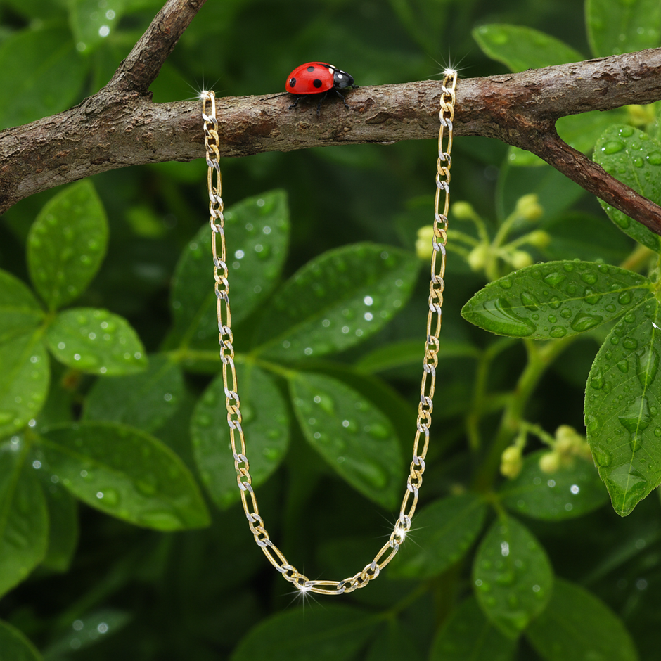 Two-toned figaro chain with ladybug and dewdrops