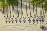 Vibrant cross necklaces beach scene