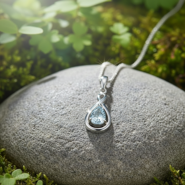 White gold aquamarine pendant facing forward with natural sparkle