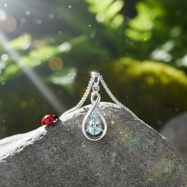 White gold aquamarine pendant with ladybug